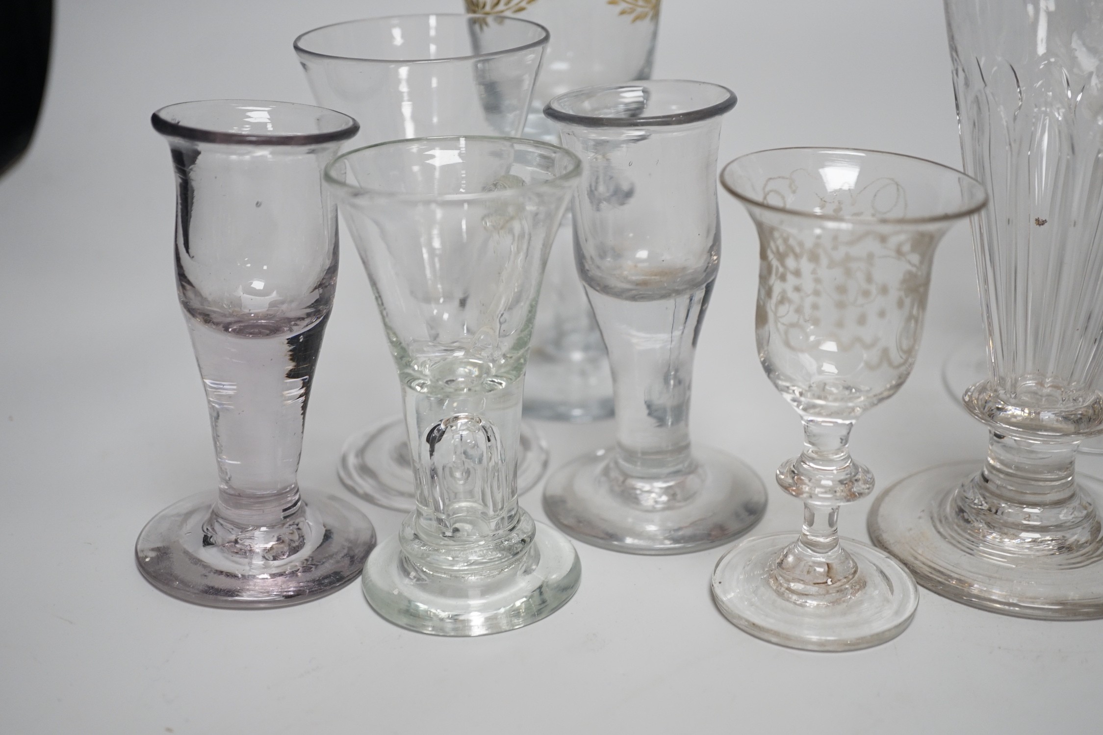 A quantity of 18th century and later glasses, tallest 18cms high